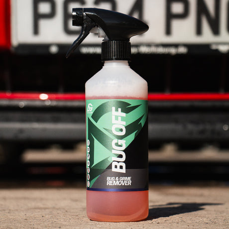 Bug Off car cleaning spray bottle with a car in the background